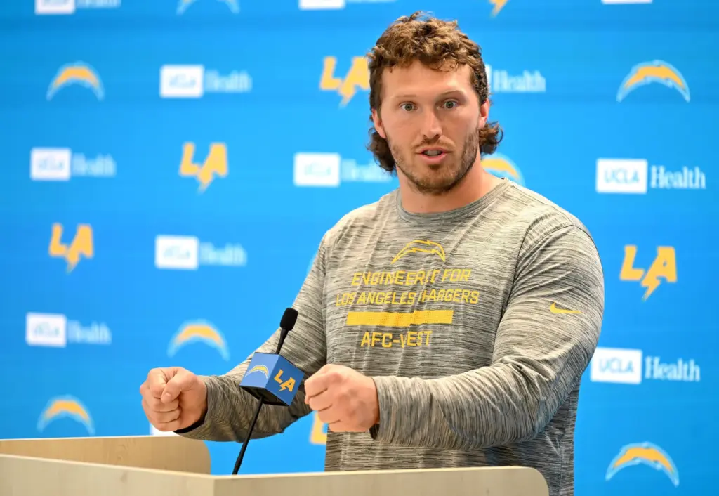 Chargers offensive guard Cole Strange speaks to the media after...