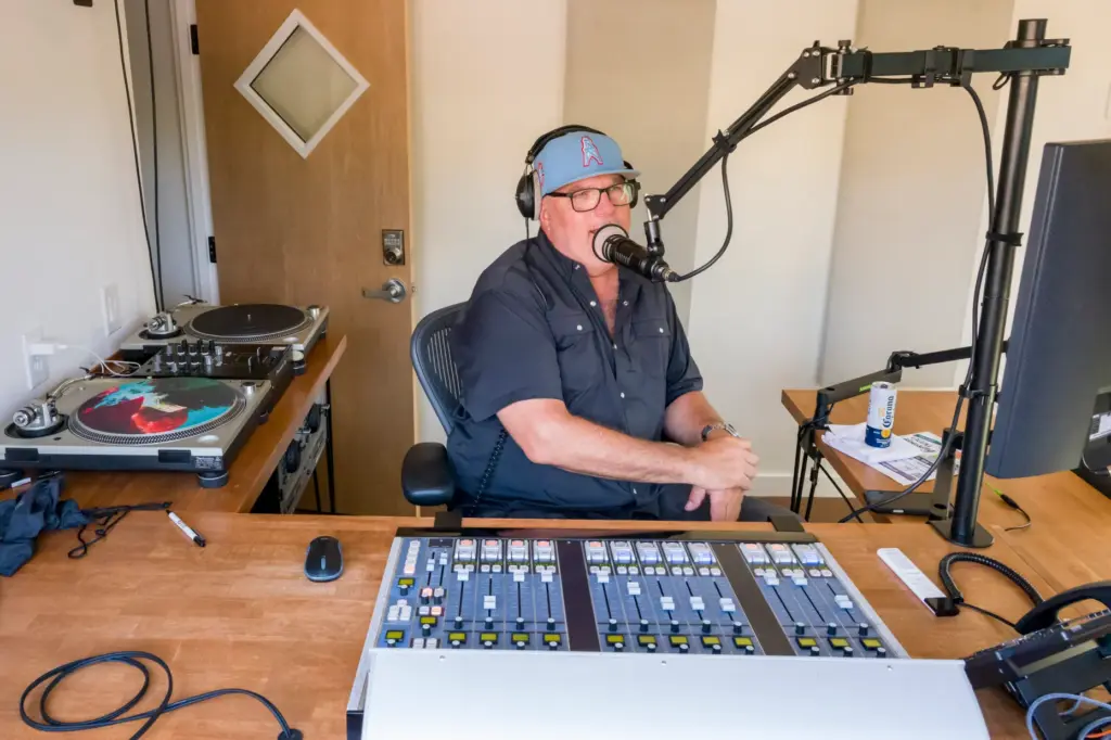 DJ Todd Katsovich in the booth at during the ribbon-cutting...