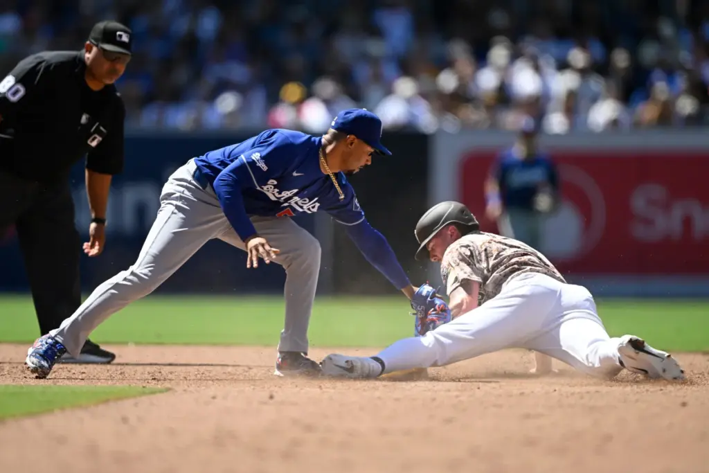 San Diego Padres’ Jackson Merrill (3) steals second base ahead...