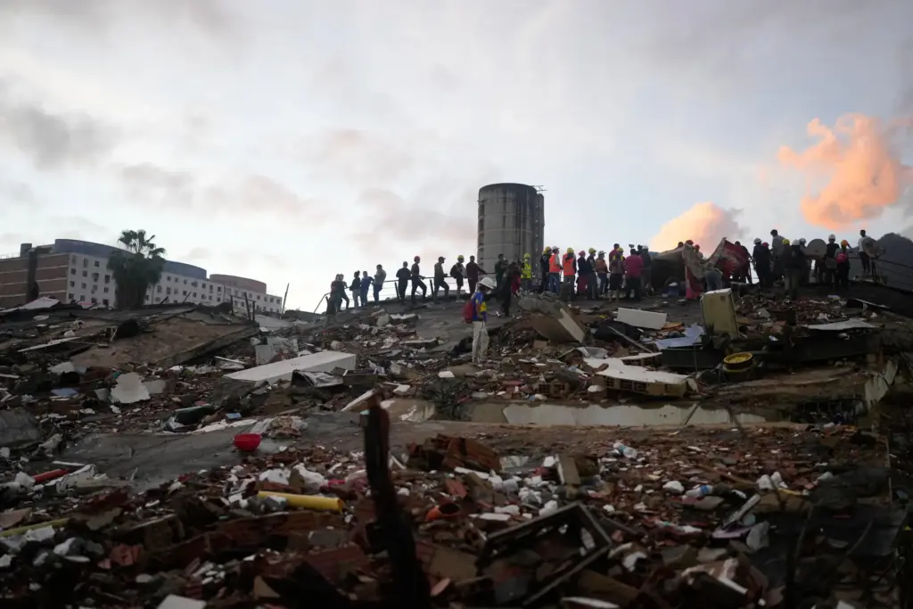 Rescuers search through the rubble of buildings that collapsed in the earthquakes.