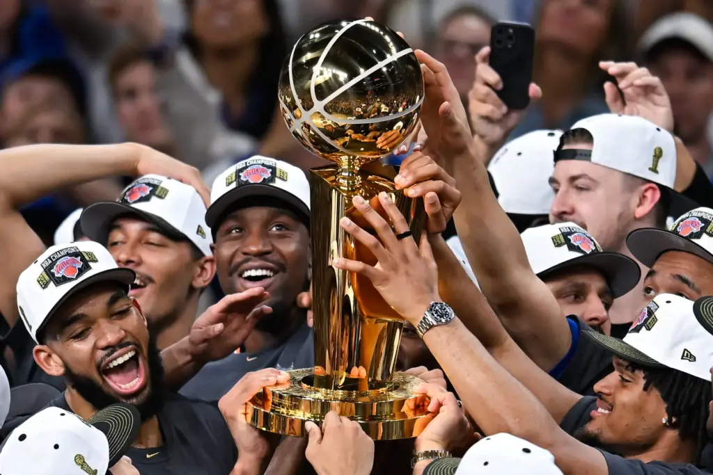 The New York Knicks celebrate with the Larry O’Brien Championship...