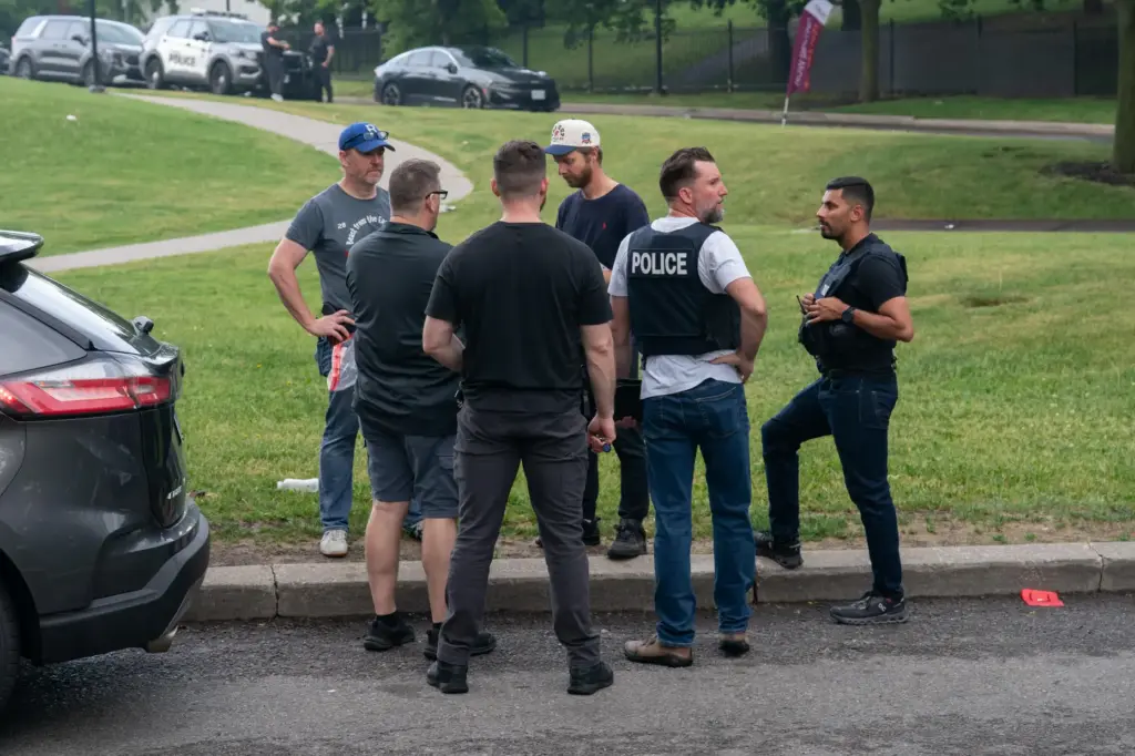 Investigators work the scene where a Toronto Police officer was...