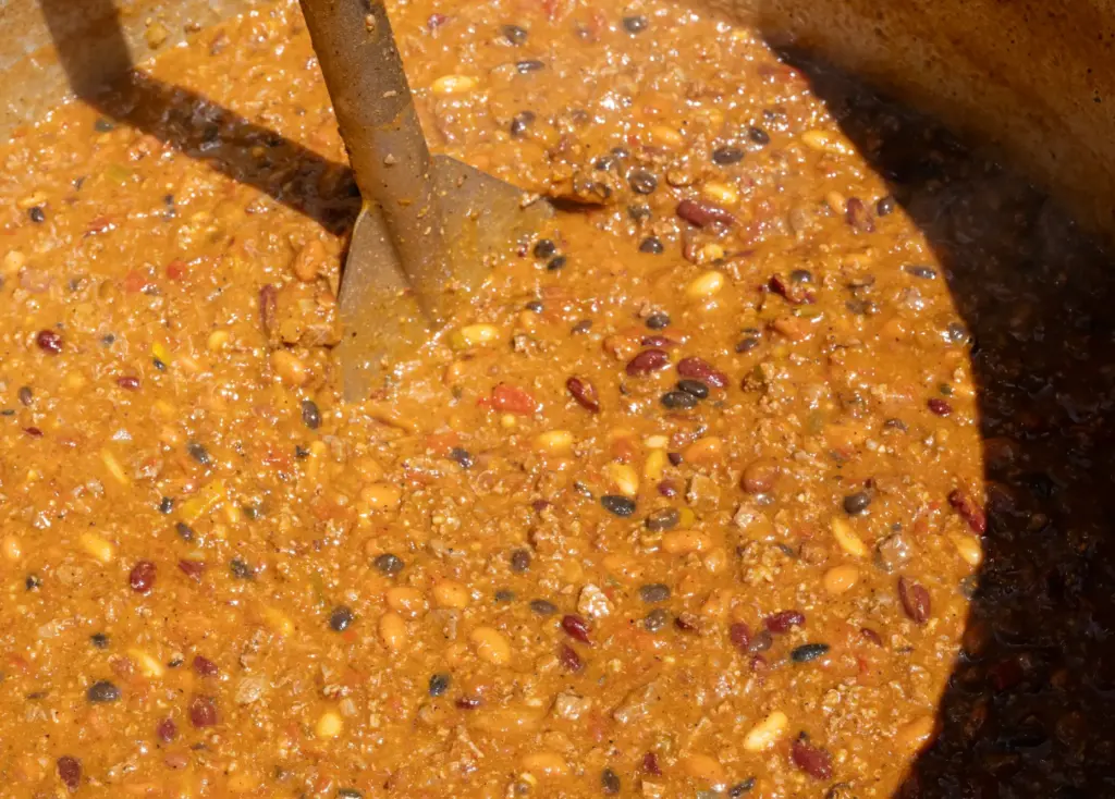 Firefighters with the OCFA stir a vat of chili at...