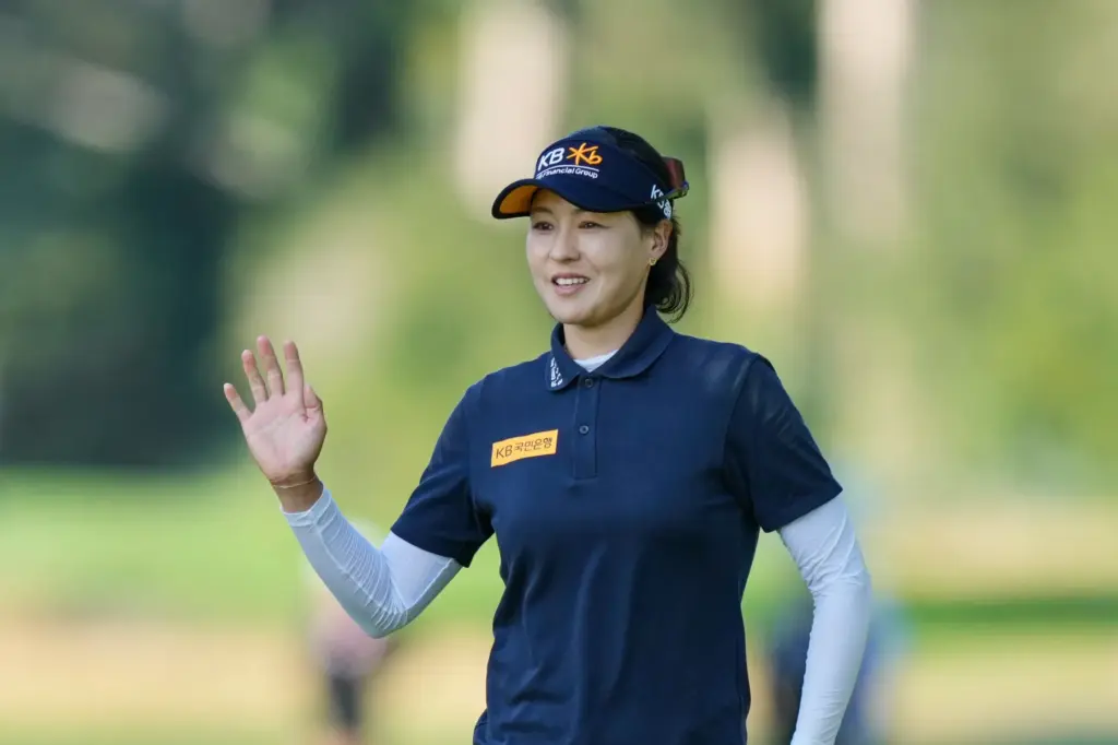 In Gee Chun, of South Korea, reacts to her putt...