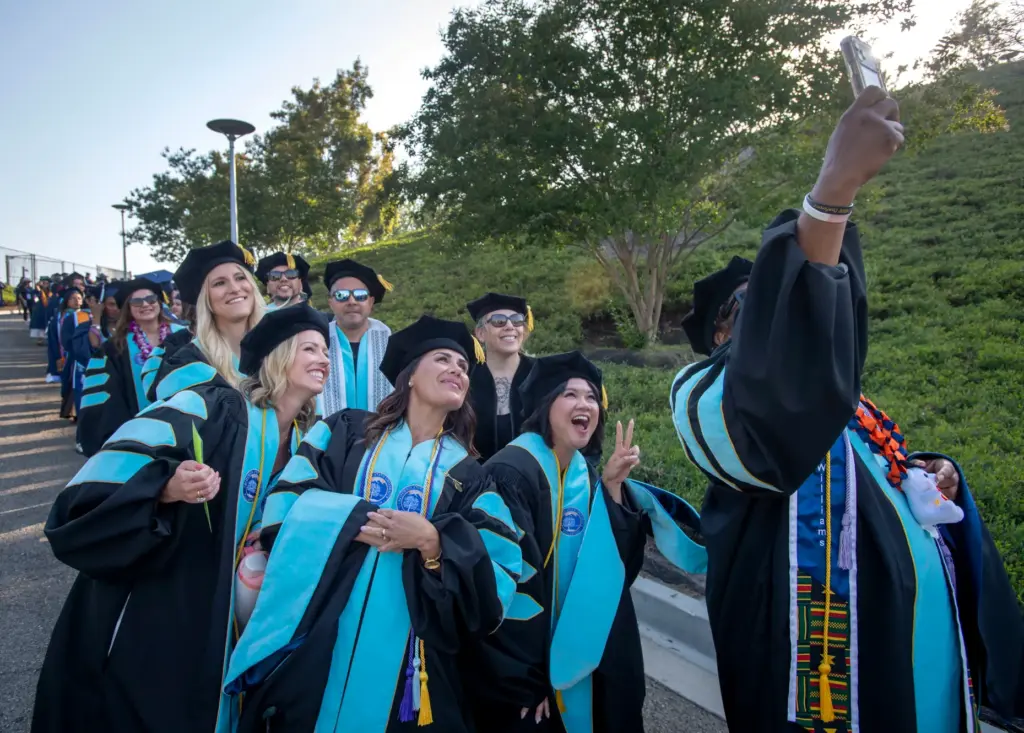 The masters cohort grabs a selfie before heading into the...