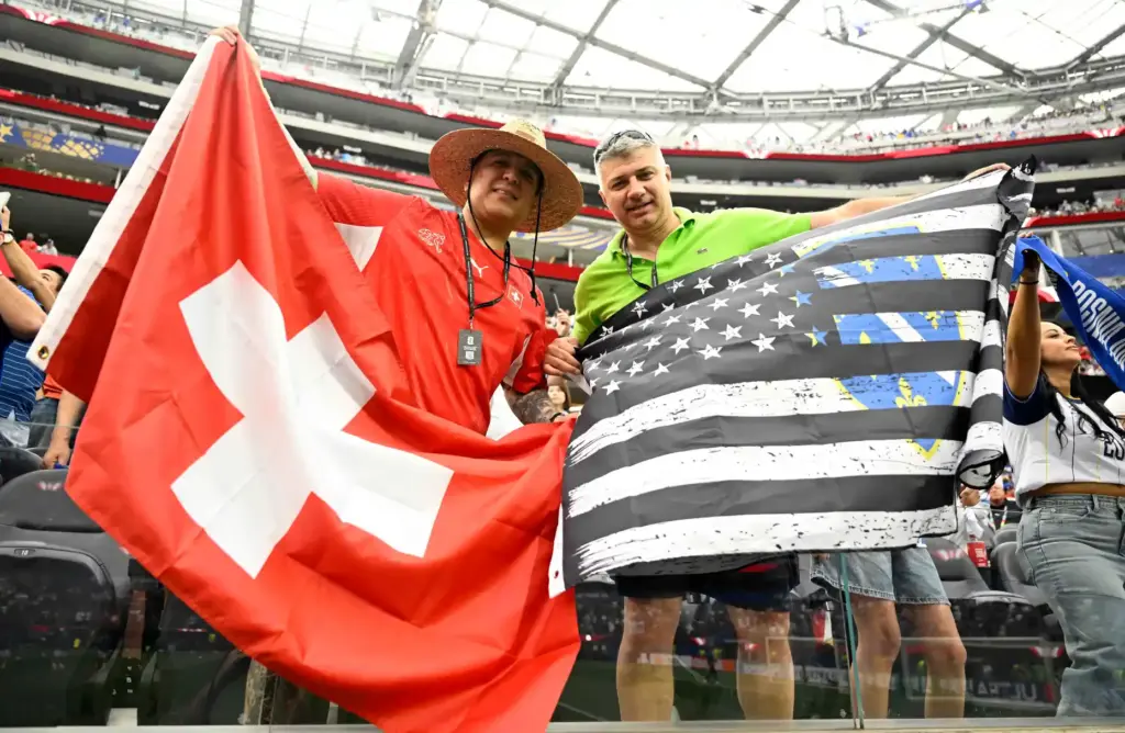 Bosnia-Herzegovina and Switzerland fans cheer during pregame activities prior to...