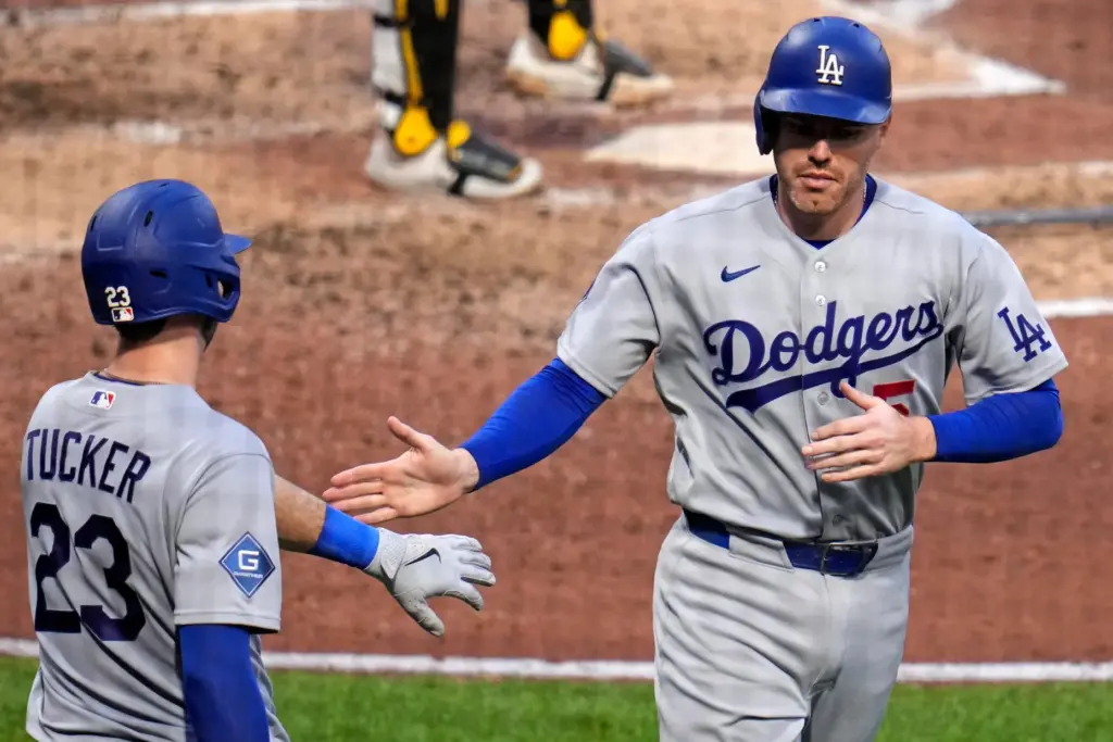 The Dodgers’ Freddie Freeman, right, is greeted by teammate Kyle...