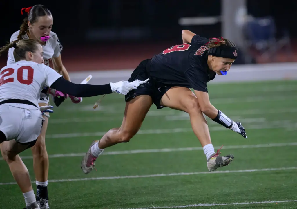 JSerra running back GG Szczuka, right, gains yardage before being...