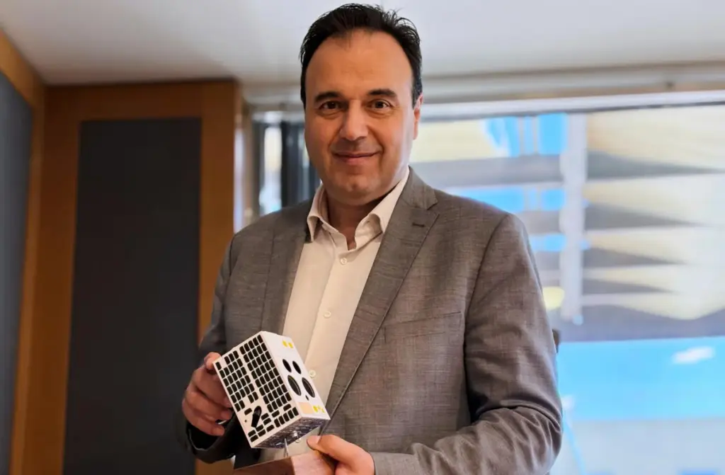 Digital Governance Minister Dimitris Papastergiou, poses with a mock-up of...