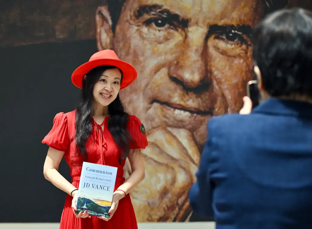 Lei Xu holds Vice President JD Vanceâs new book, âCommunion:...