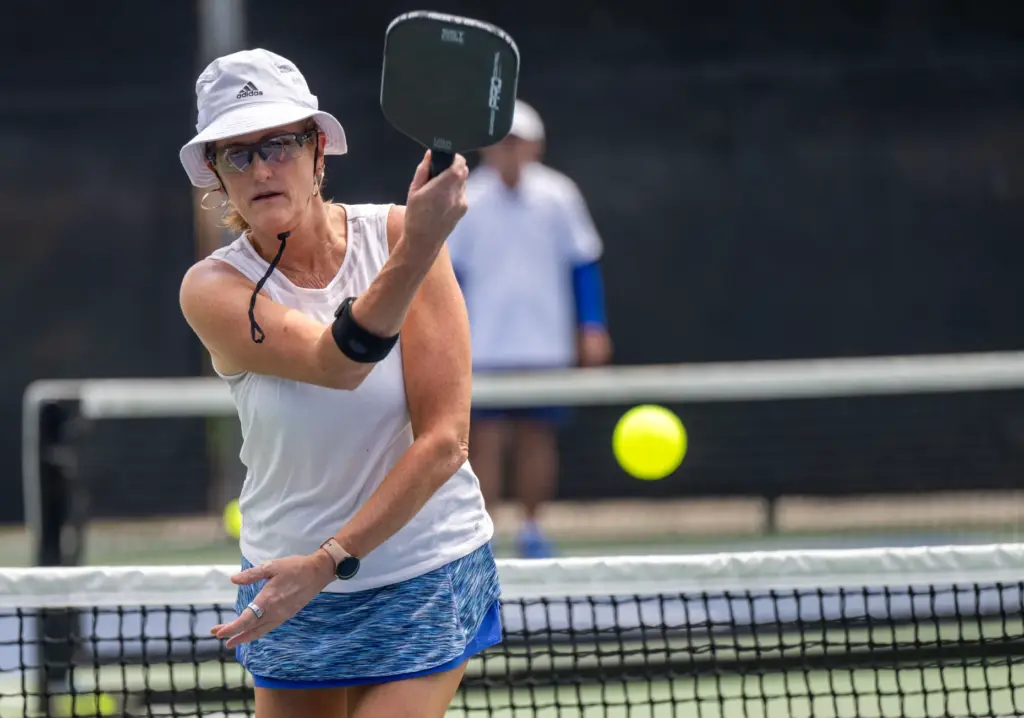Catherine Patience of Laguna Niguel hits the ball while competing...