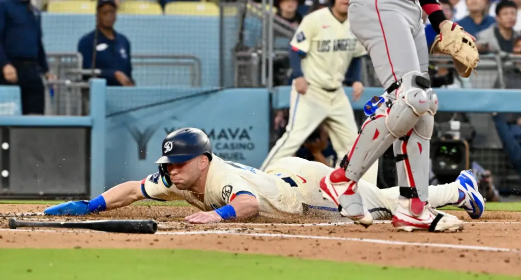 Daulton Rushing #68 of the Dodgers scores on a double...