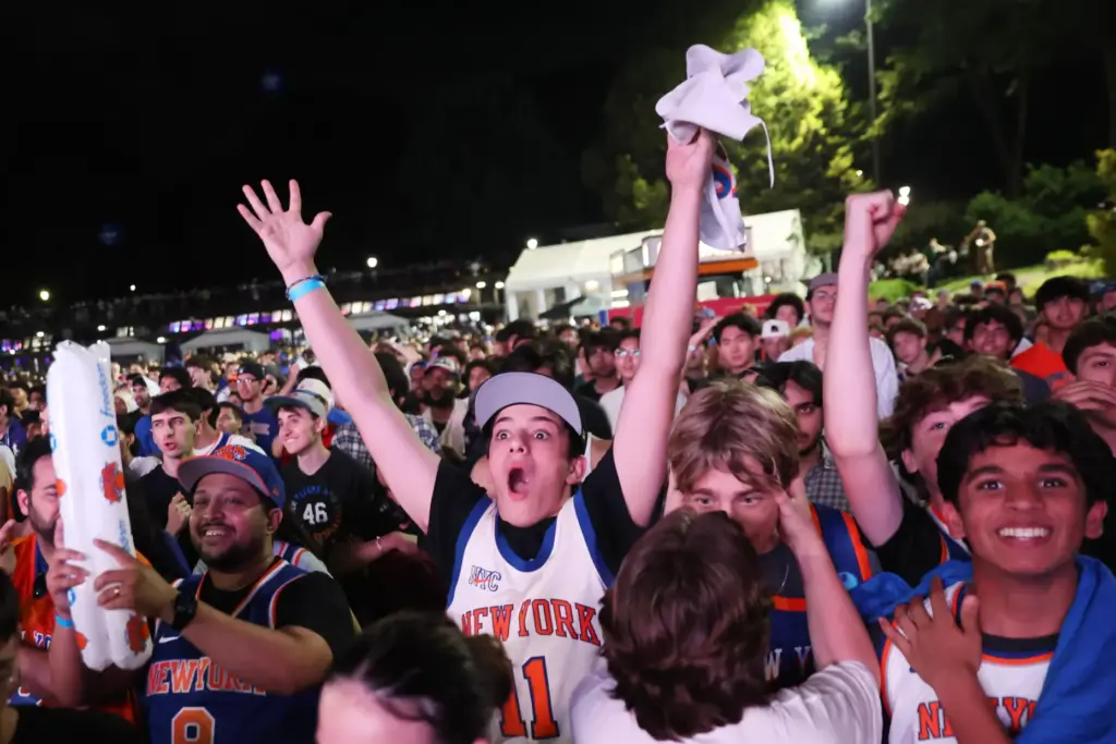 New York Knicks fans react during a watch party inside...