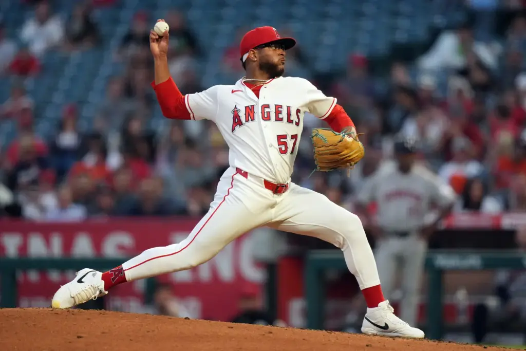 Angels starting pitcher Walbert Urena throws to the plate during...