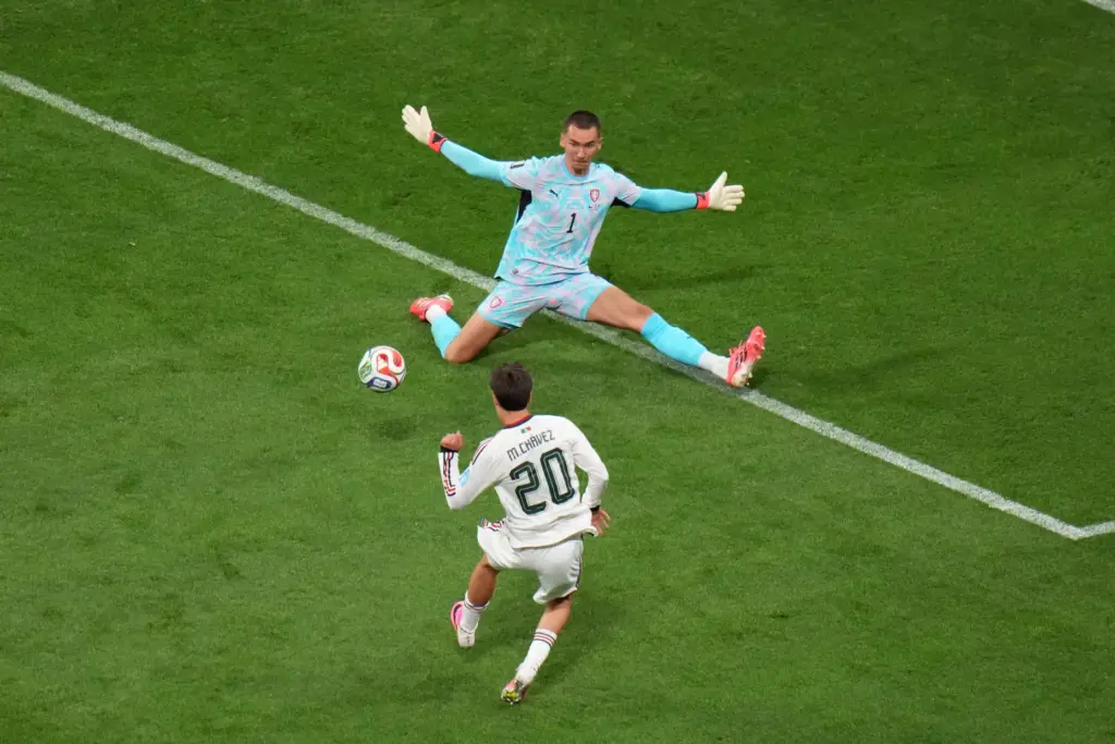 Mexico's Mateo Chavez shoots and scores the team's opening goal against Czechia goalkeeper Matej Kovar.