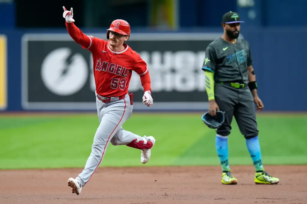 The Angels’ Wade Meckler gestures as he runs the bases...