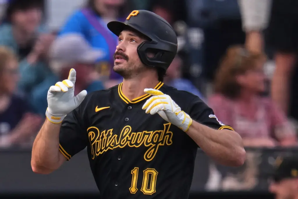 The Pittsburgh Pirates’ Bryan Reynolds gestures as he runs the...