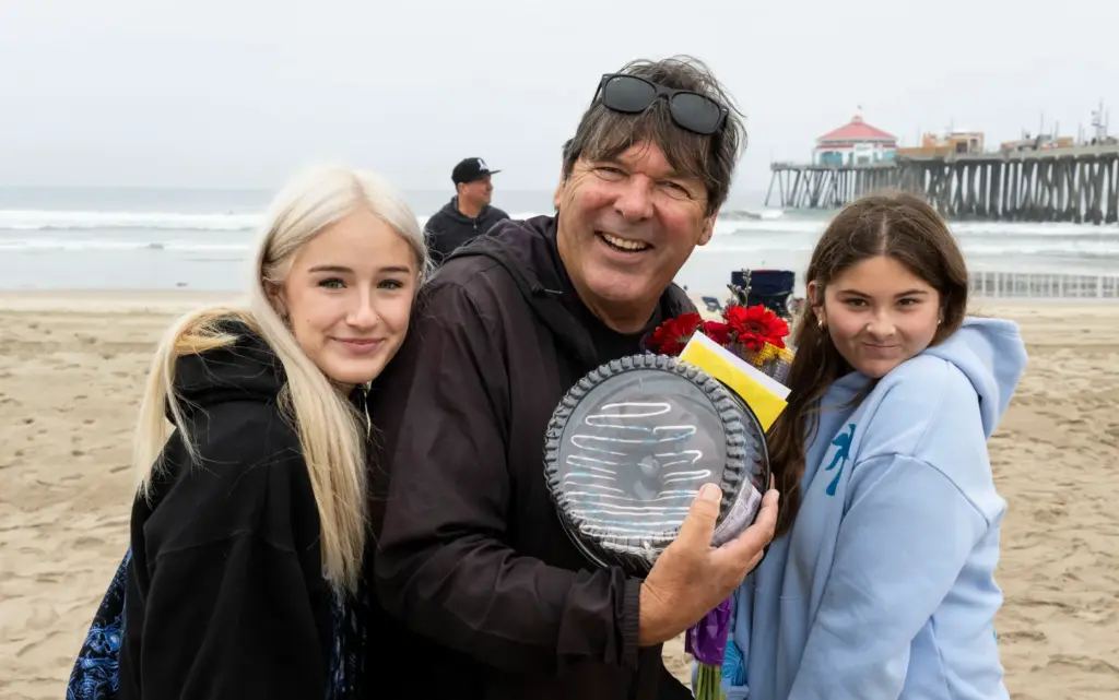 Huntington Beach High School surf team members Ziah Santa Cruz,...