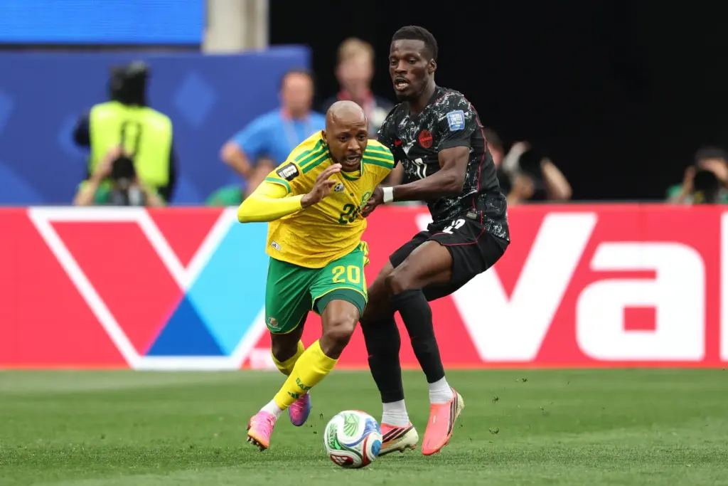 South Africa defender Khuliso Mudau (20) battles with Canada forward...