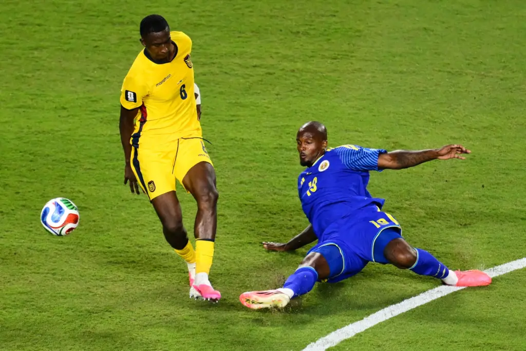 CuraÃ§ao’s Gervane Kastaneer (19) and Ecuador’s Willian Pacho (6) battle...
