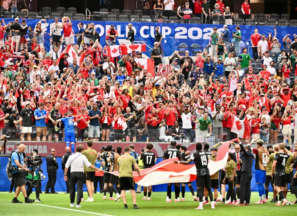 Canada celebrates toward the fans after defeating South Africa 1-0...