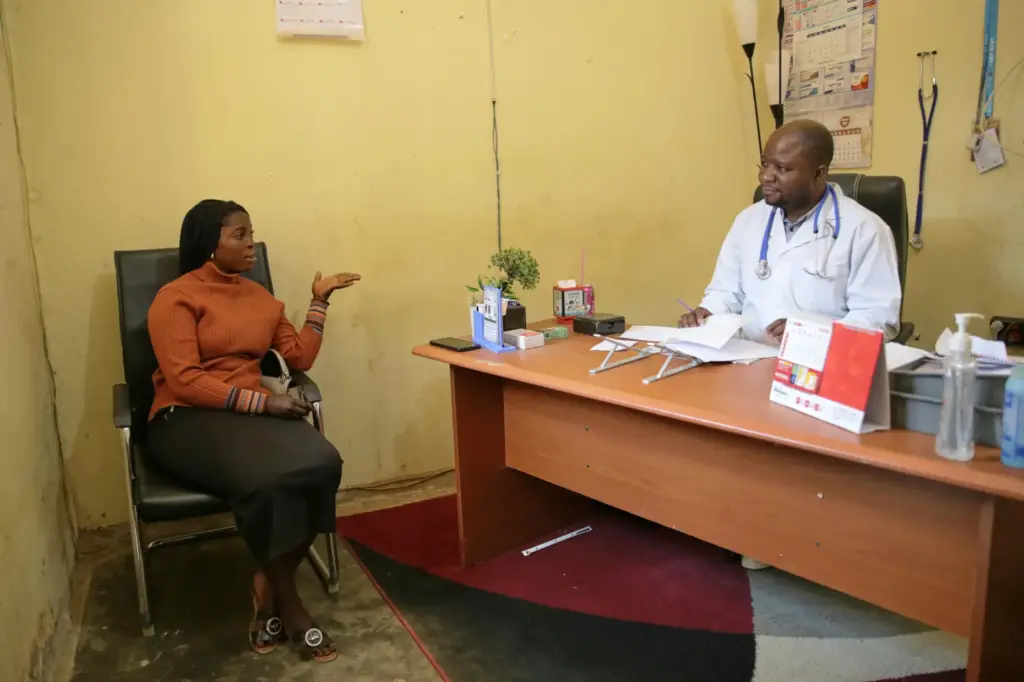 Dr. Babah Mutuza Lusungu, right, a doctor at “Dieu Est...