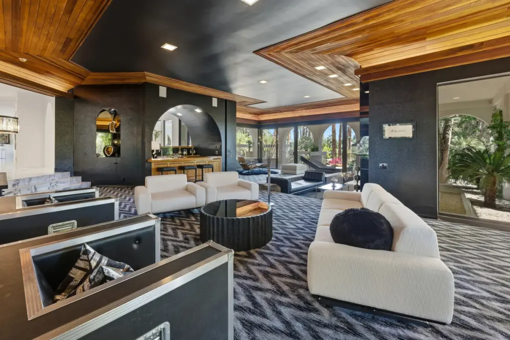 The living room features an enclosed wet bar with counter....