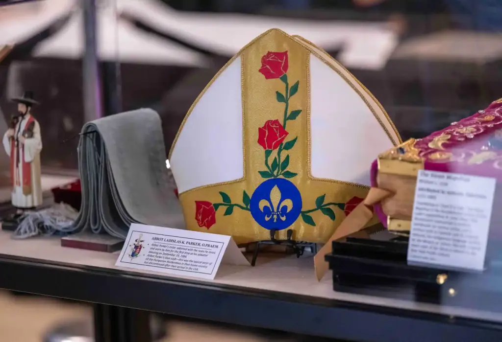 A ceremonial miter, or headdress, and sash, worn by Abbot...