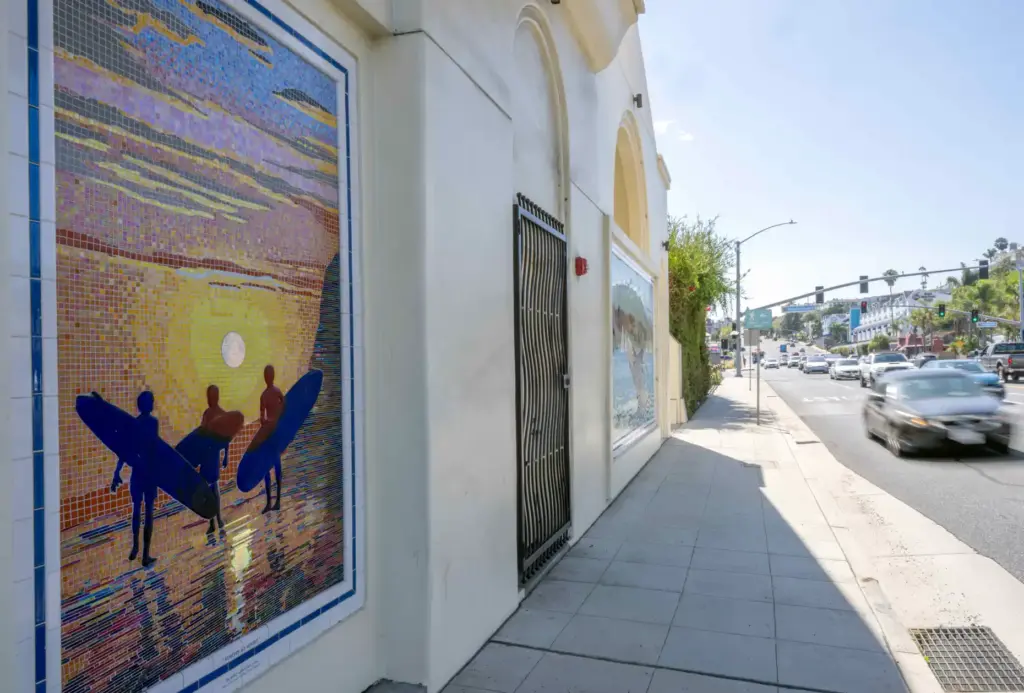 âSurfers at Sunset,â by artist Lance Jost, is a mosaic...