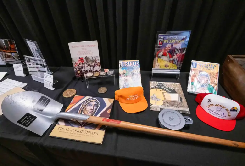A collection of various historical documents and objects sits on...