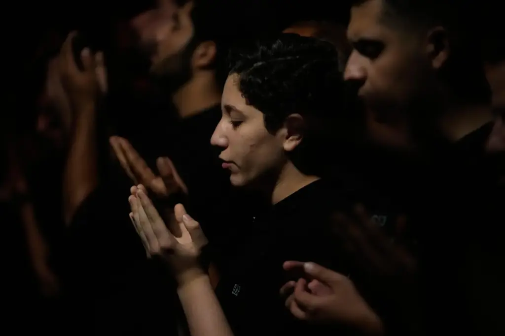 Iranians perform their evening prayers in a mourning ceremony in Tehran.