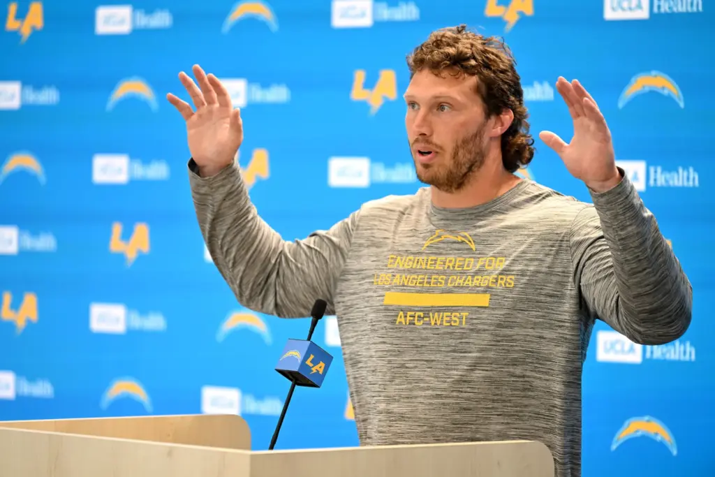 Chargers offensive guard Cole Strange speaks to the media after...