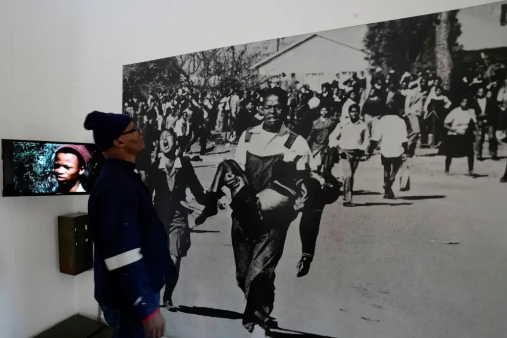 A man looks at a June 16 iconic image taken by the late Sam Nzima.