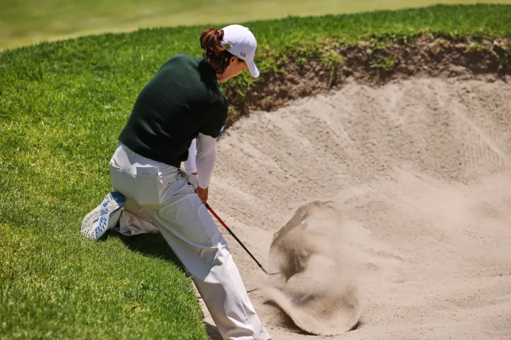 In Gee Chun, of South Korea, hits out of the...
