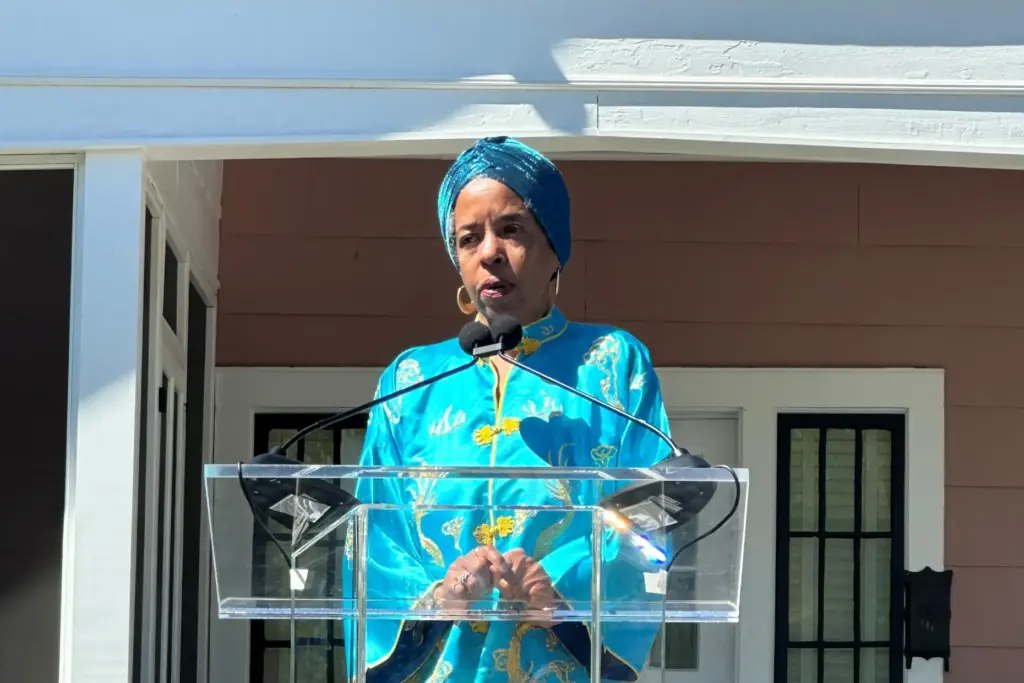 Jawana Jackson speaks at a ribbon cutting of her reconstructed...