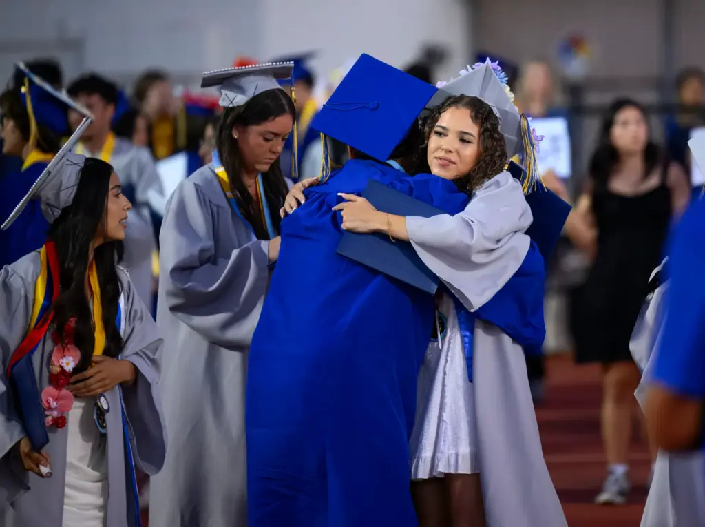 Graduates congratulate each other following the Valencia High School graduation...