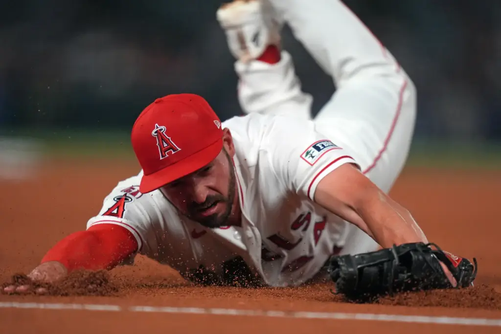 Angels first baseman Trey Mancini can’t catch an RBI single...