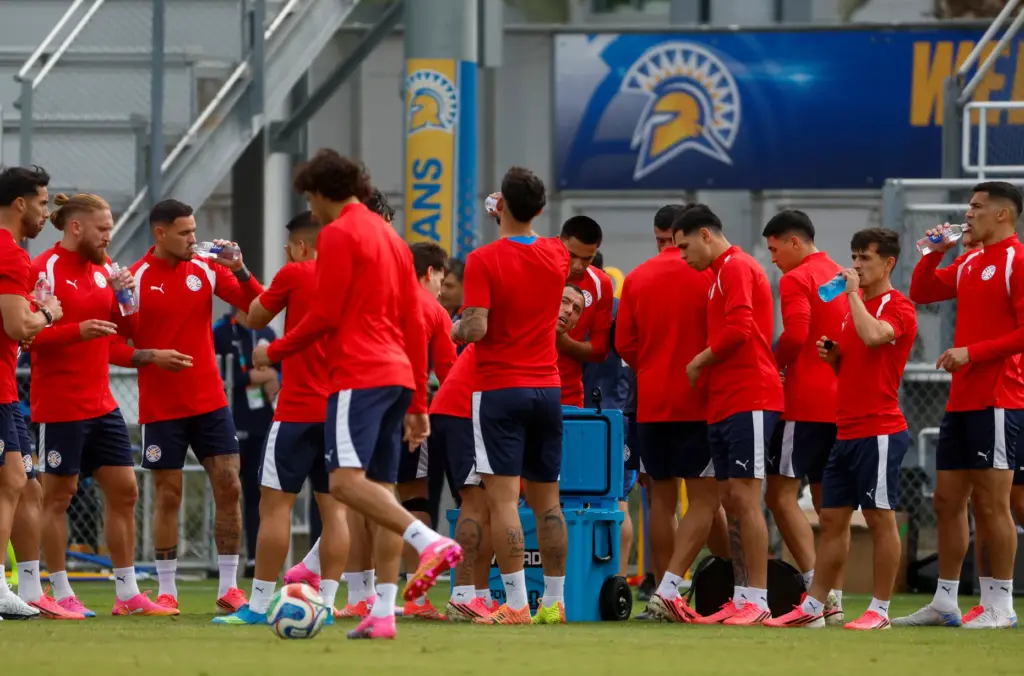 Members of Paraguay’s national soccer team take a water break...