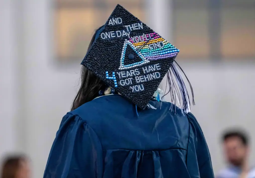 One graduate wears a customized cap that reads, âand then...