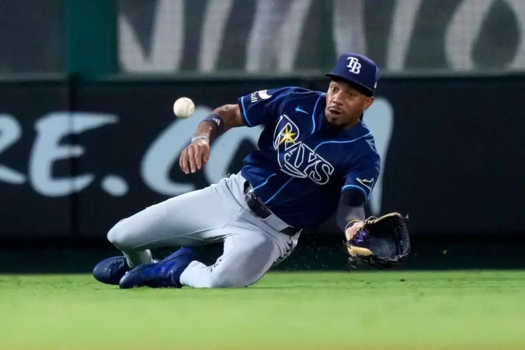 Tampa Bay Rays left fielder Chandler Simpson can’t handle a...