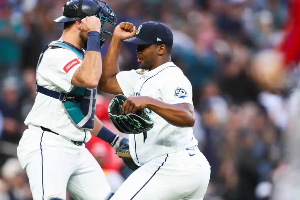 Seattle Mariners relief pitcher JosÃ© A. Ferrer celebrates with catcher...