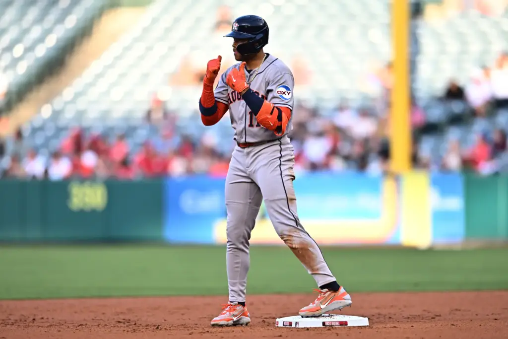 The Houston Astros’ Cam Smith gestures after hitting a double...