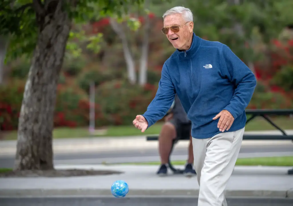 John Bauman of Laguna Niguel takes his turn tossing a...