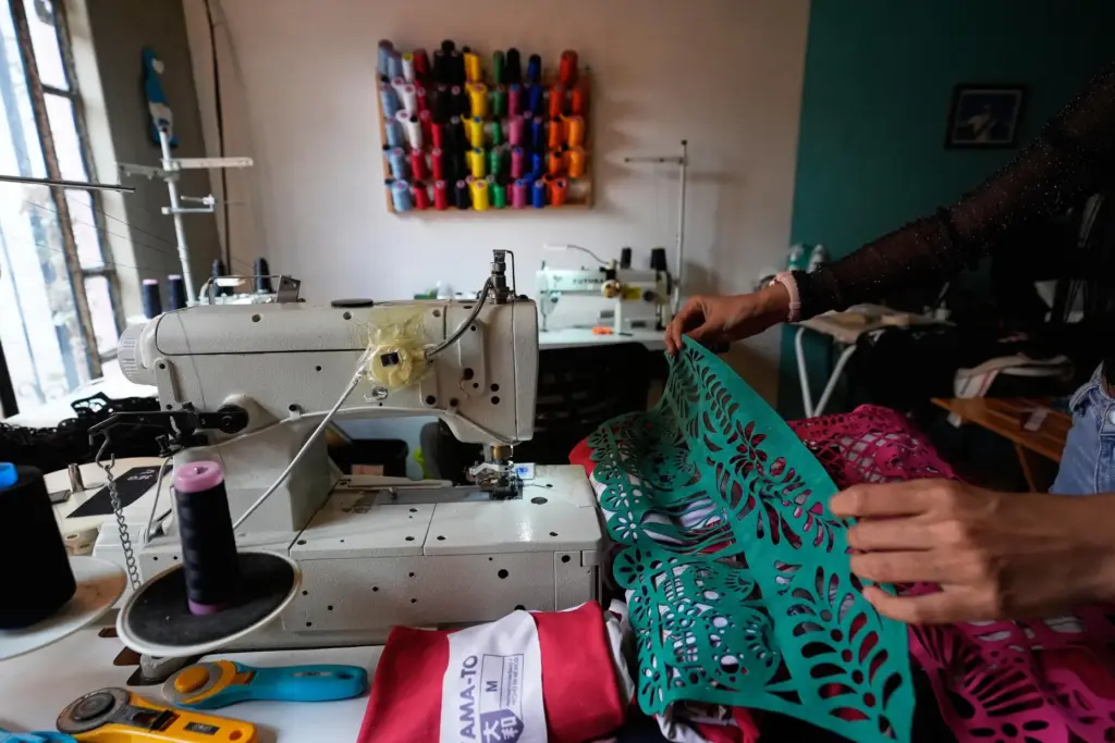 Cande Martinez prepares soccer jerseys, inspired by papel picado and...
