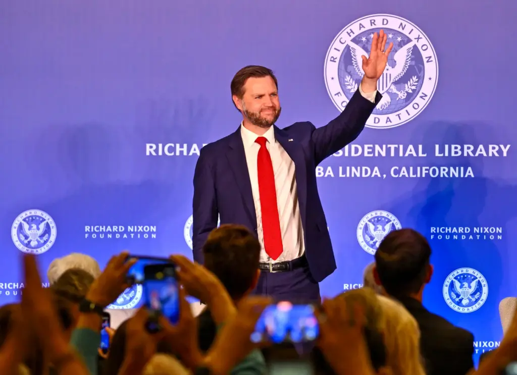 Vice President JD Vance acknowledges the crowd after a chat...