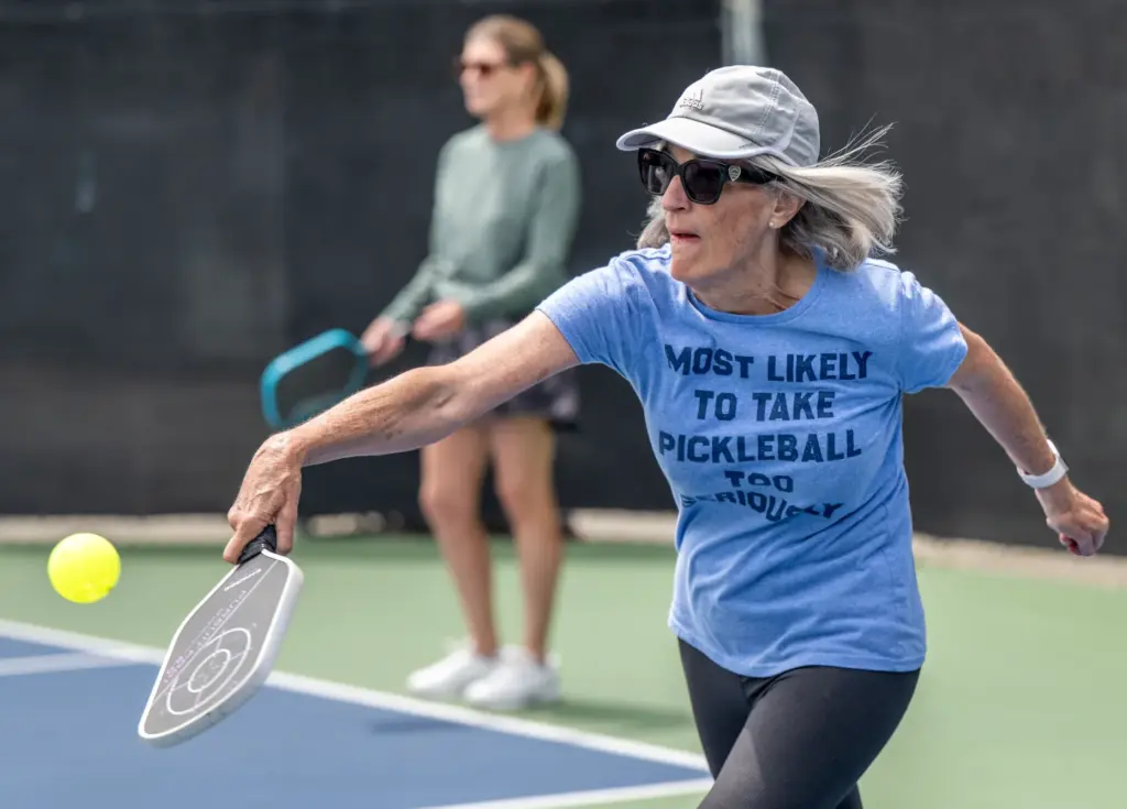Doree Pisano of Laguna Hills hits the ball while wearing...