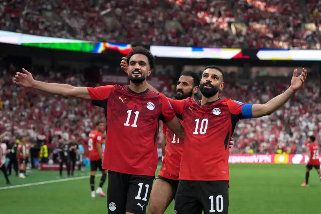 Egypt’s Mohamed Salah (10) celebrates his goal with teammate Mostafa...