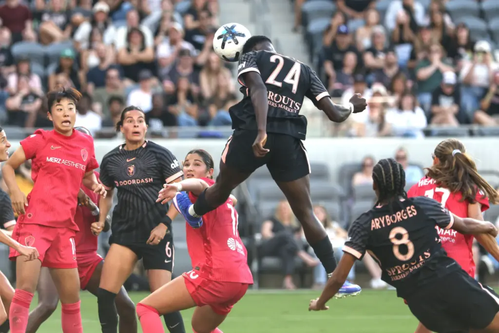Angel City FC forward Prisca Chilufya (24) heads the ball...