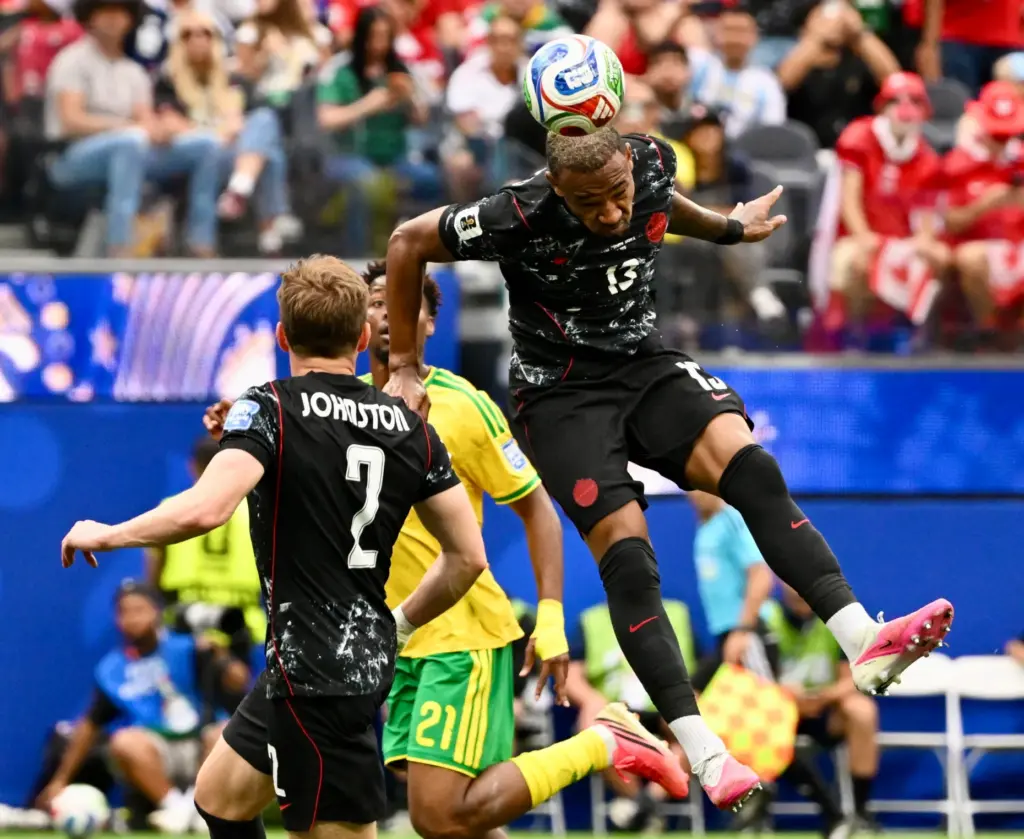 Canada defender Derek Cornelius (13) with a header towards the...