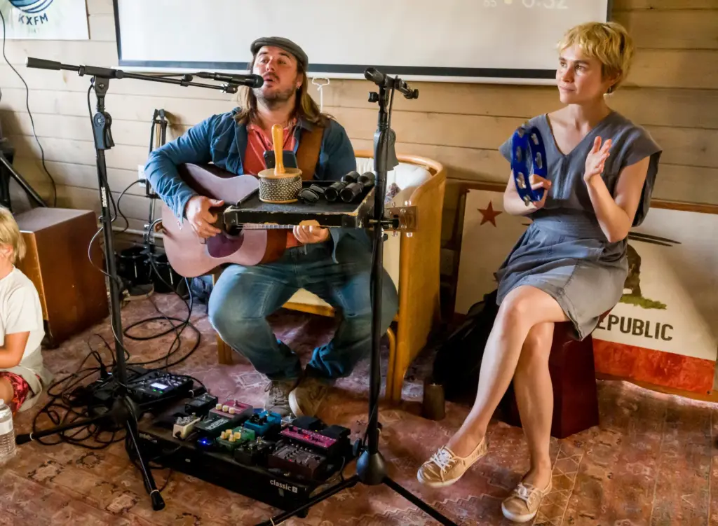 Musicians Zach Churchill and Daria Pugachova perform during a ribbon-cutting...